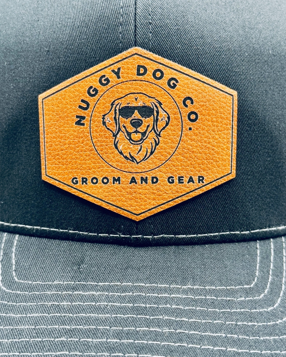Nuggy Dog Co. logo on a cap with a grey background