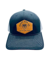 Grey cap with a yellow logo on a white background