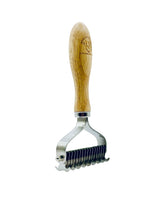 Metallic kitchen tool with wooden handle on a white background
