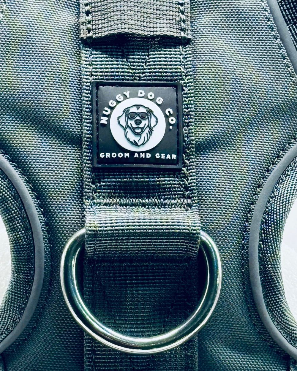 Nugget Dog Co. label on a green dog grooming bag with a metal ring.