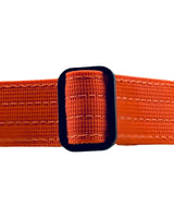 Orange belt with a black buckle on a white background