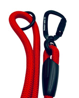 Red rope with black carabiner and clip on a white background