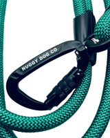 Teal dog leash with black carabiner and Nuggy Dog Co. branding on a white background