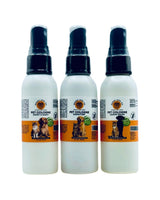 Three bottles of pet cologne with spray nozzles on a white background