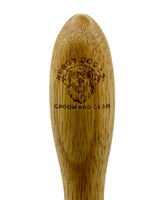Wooden grooming brush with 'Nobby Dog' branding on a white background