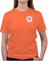 Person wearing an orange t-shirt with a logo on the chest